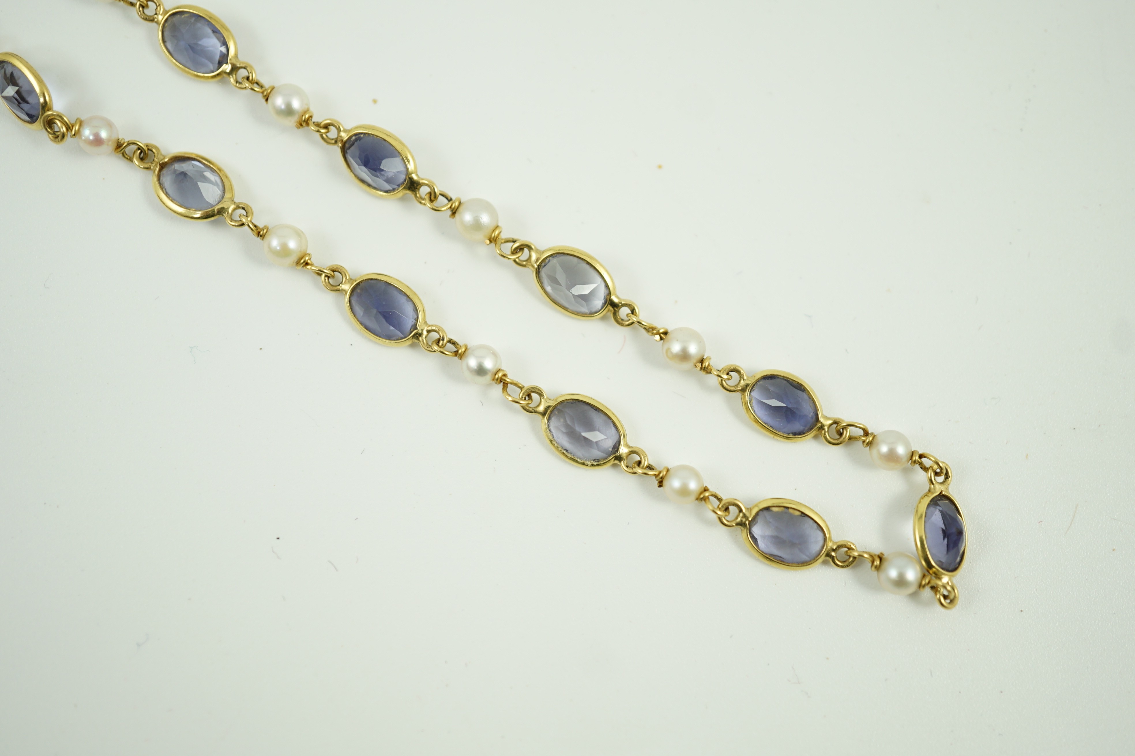 A modern 18ct gold, blue quartz and cultured pearl set spectacle necklace, 58cm, gross weight 15 grams.